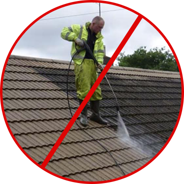 Image showing how not to wash your roof. You can see a pressure washer cleaning roof tiles with high pressure. You can also see a red circle with a diagonal line through the image indicating thats not how to wash a roof.